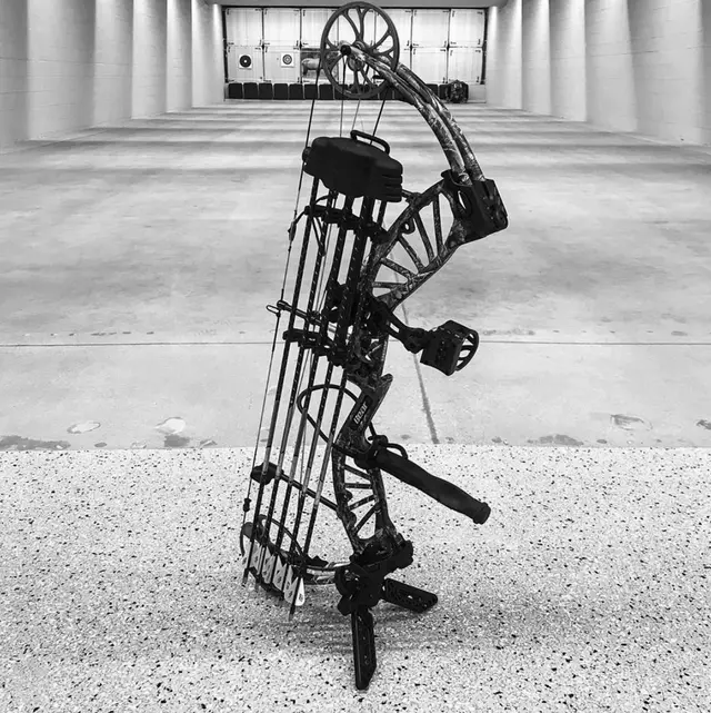 A compound bow standing in the archery range